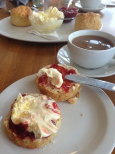 Muffin with clotted cream and jam and cream tea.